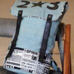 Denim canvas backpack with newspaper print panel and leather straps, handcrafted Rajasthan, BU134