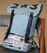 Denim canvas backpack with newspaper print panel and leather straps, handcrafted Rajasthan, BU134