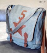 Grey canvas messenger bag with leather star appliqué and buckle straps, handcrafted Rajasthan, BU131