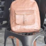 Handcrafted tan leather backpack with front buckle pocket, industrial look, Rajasthan-made, BU109