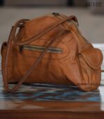 Handcrafted tan leather duffle bag with front zip pocket, vintage finish, Rajasthan-made
