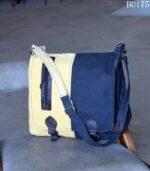 Mustard and navy two-tone canvas messenger bag, handcrafted in Rajasthan. Custom color combinations, private-label branding, worldwide export.