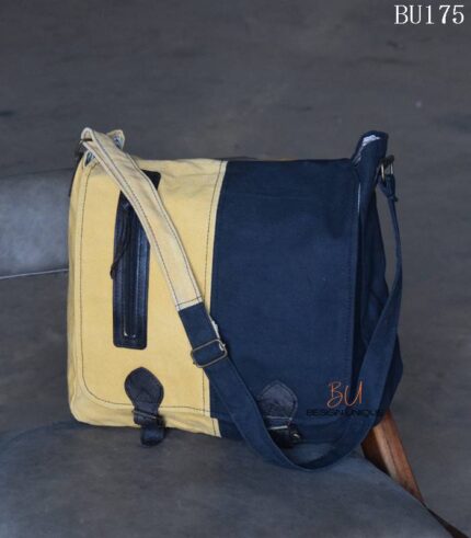 Mustard and navy two-tone canvas messenger bag, handcrafted in Rajasthan. Custom color combinations, private-label branding, worldwide export.