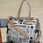 Newspaper print canvas duffle bag with tan leather trim, handcrafted Rajasthan, BU129