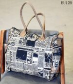 Newspaper print canvas duffle bag with tan leather trim, handcrafted Rajasthan, BU129