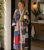 Woman wearing blue and cream patchwork kantha robe with ivory trim, Rajasthan-made vintage sari robe