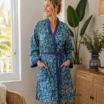 Woman wearing blue floral hand block-print cotton kimono robe with contrast trim, Rajasthan-made loungewear BUW502