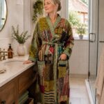 Woman wearing green and maroon patchwork kantha robe with sage green trim, Rajasthan-made vintage sari robe BUW509