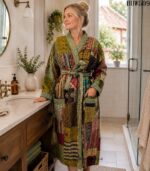 Woman wearing green and maroon patchwork kantha robe with sage green trim, Rajasthan-made vintage sari robe BUW509
