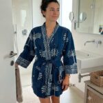 Woman wearing indigo kantha cotton kimono robe with hand-stitched palm print, reversible unisex loungewear from Rajasthan BUW501