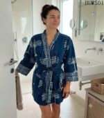 Woman wearing indigo kantha cotton kimono robe with hand-stitched palm print, reversible unisex loungewear from Rajasthan BUW501