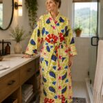 Woman wearing ivory paisley and floral print cotton kimono robe, vintage-style handmade design from Rajasthan BUW507
