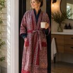 Woman wearing maroon and ivory ajrakh-style kantha robe with color-block trim, luxury designer robe from Rajasthan BUW511