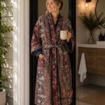 Woman wearing navy and rust striped tapestry print cotton robe with navy trim, handcrafted in Rajasthan BUW513