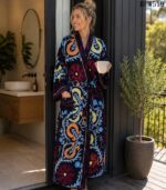 Woman wearing navy suzani floral and paisley print cotton robe with white piping, handcrafted in Rajasthan BUW519