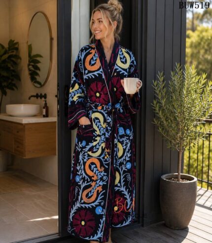 Woman wearing navy suzani floral and paisley print cotton robe with white piping, handcrafted in Rajasthan BUW519