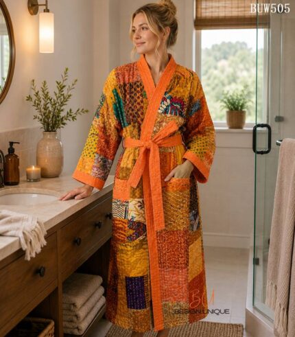 Woman wearing orange and gold patchwork kantha robe made from vintage sari fabric, Rajasthan-made loungewear BUW505